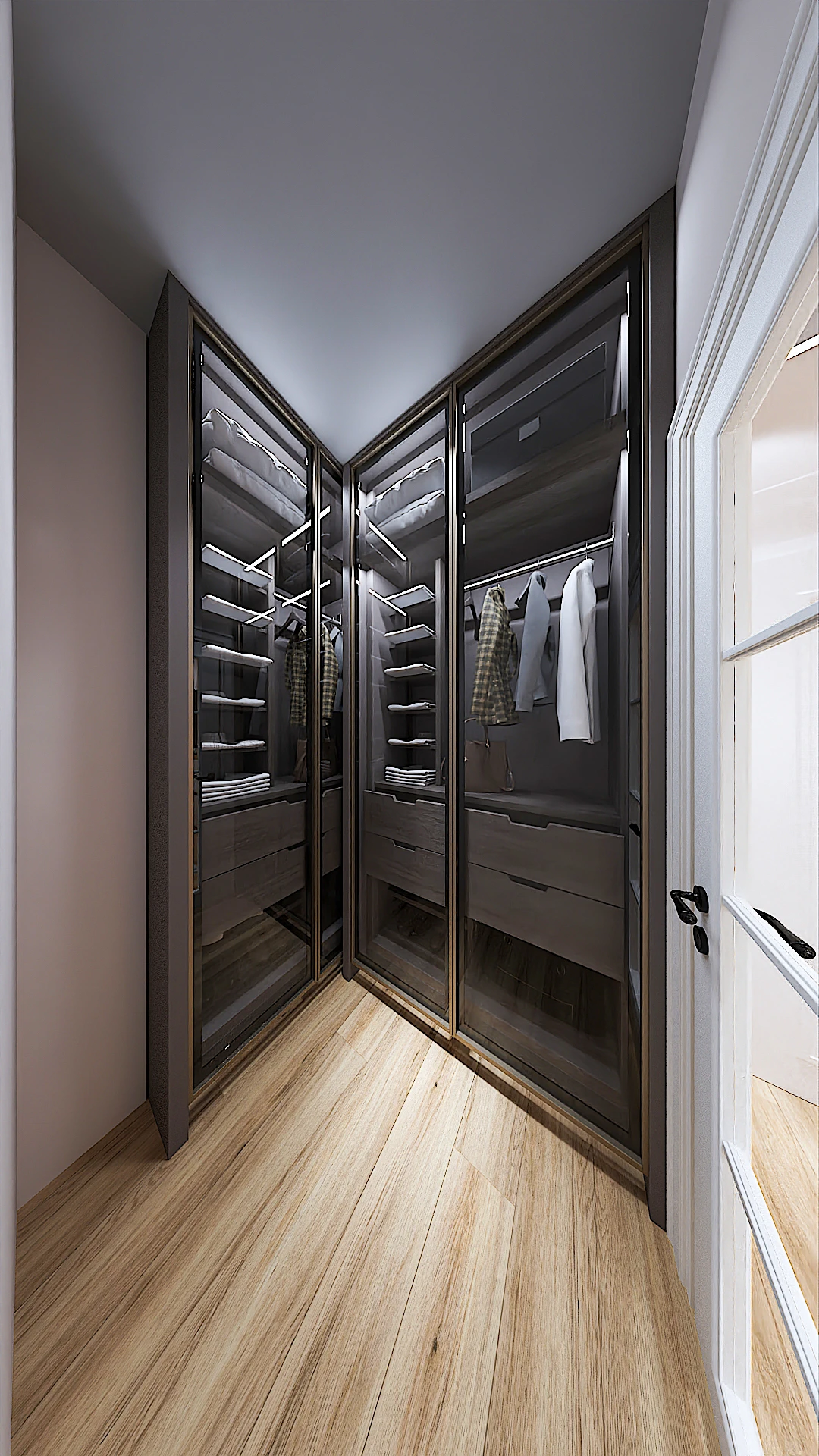 Galeria 31 Këndi i garderobës walk-in closet me dollapë me dyer xhami, strukturë gri e errët, organizim të brendshëm dhe dysheme druri - Projekt interior design nga Studio Arkitekture